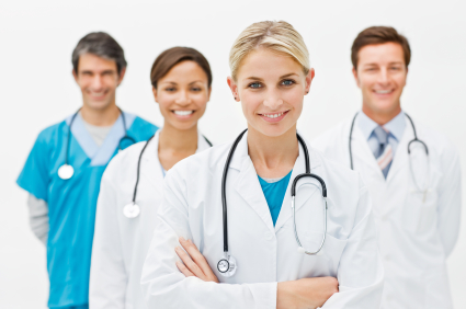 Beautiful doctor standing with hands folded and assistant doctor